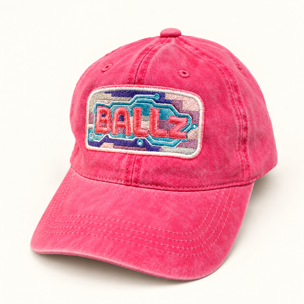 Three-quarter front view of the hot pink BALLz embroidered ponytail hat.