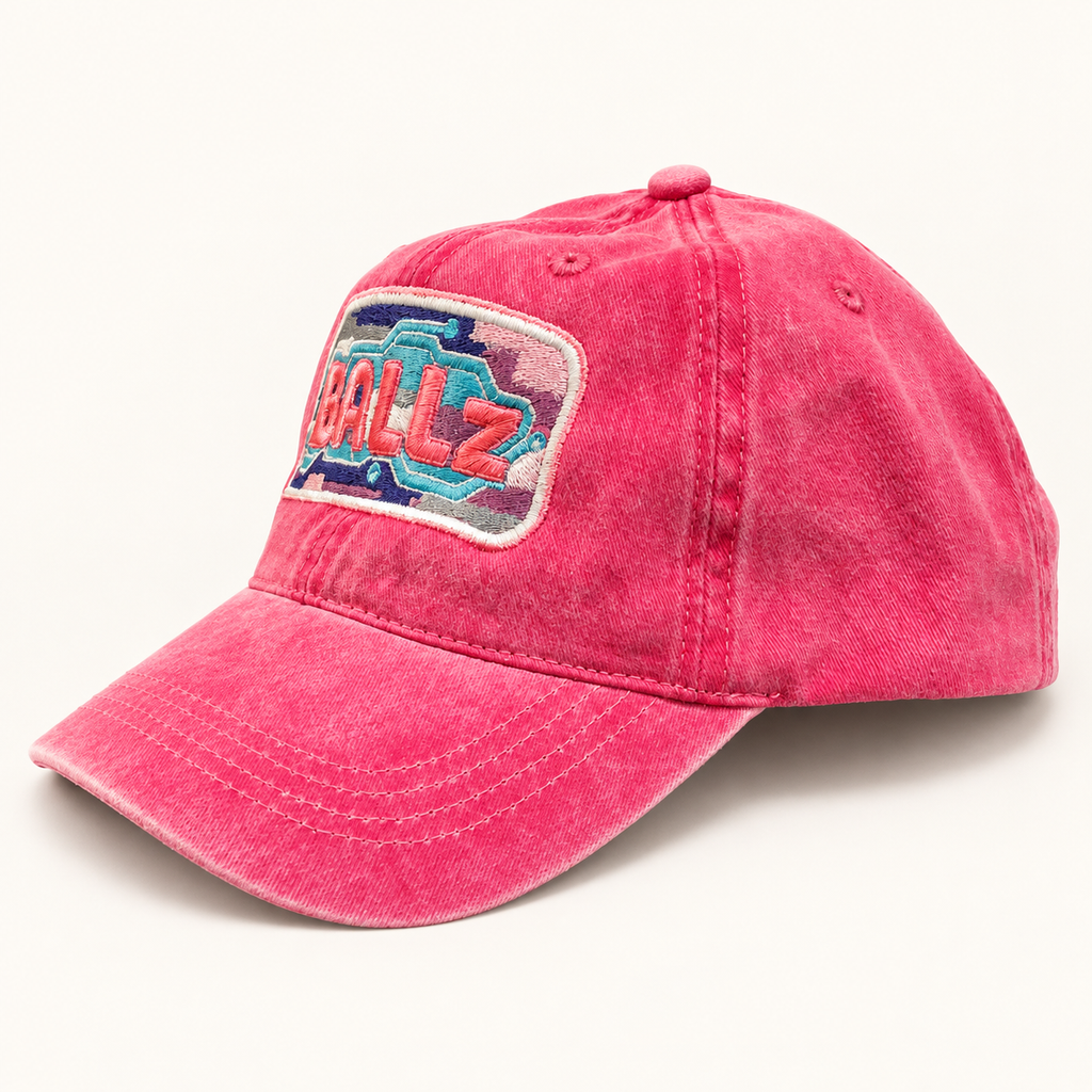 Side profile of the hot pink distressed BALLz embroidered baseball hat.