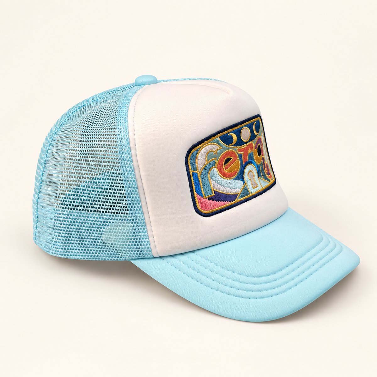 Opposite three-quarter view of the FERAL embroidered trucker hat, showing the white front, aqua brim and mesh back.