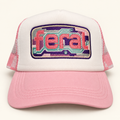 Front view of a white FERAL cassette embroidered trucker hat with a pink brim and plaid mesh.