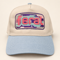 Front view of a cream FERAL cassette embroidered trucker hat with a powder-blue brim.